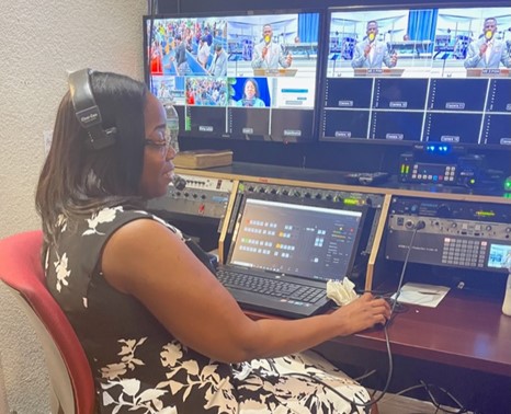 Charlene Tilbanie running the audio-visuals at Victory Tabernacle – Church of God of Prophecy Cayman.