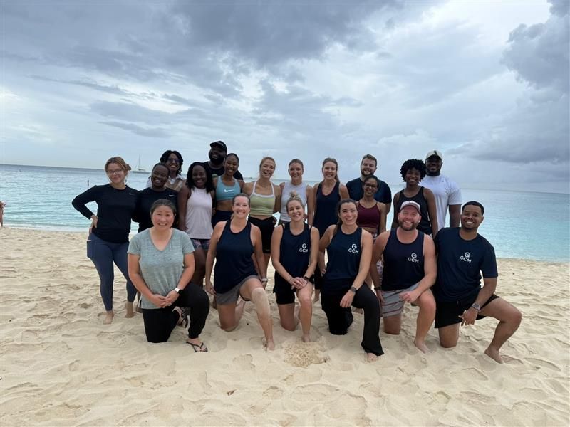 GCM team gathered on beach.